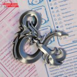 Dungeons and Dragons metal medallion,D&D ampersand medallion,Dungeons and Dragons gift for Dungeon Master,DnD collector's gift UK,official D&D merchandise UK,Dungeon Master gift ideas,D&D limited edition collectible,DnD metal medallion,Dungeons and Dragons jewellery,tabletop gaming gifts UK,D&D memorabilia UK,official Dungeons and Dragons merch