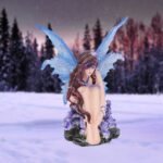 d1598e5 7.jpg Fairy figurine in snowy forest.