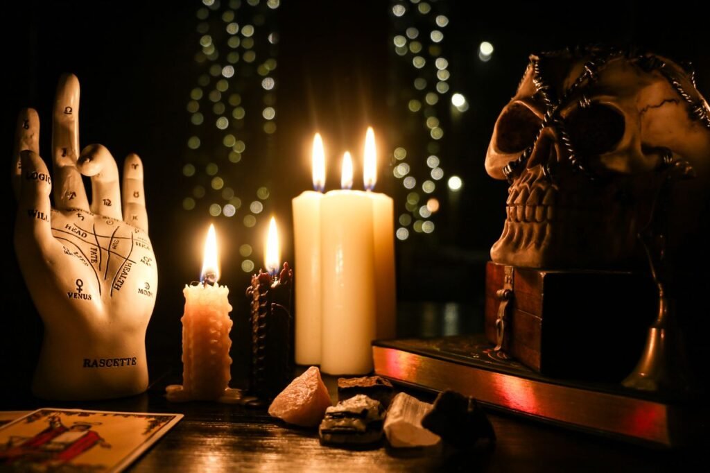 Candles, skull, and tarot cards.