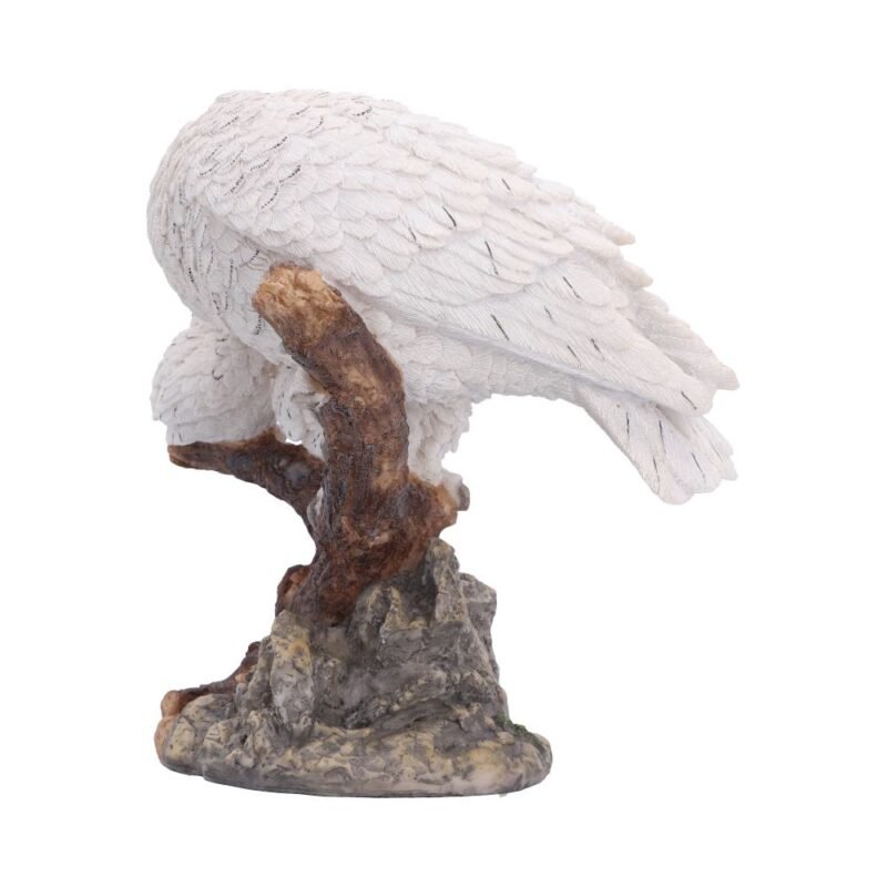 White owl statue on branch