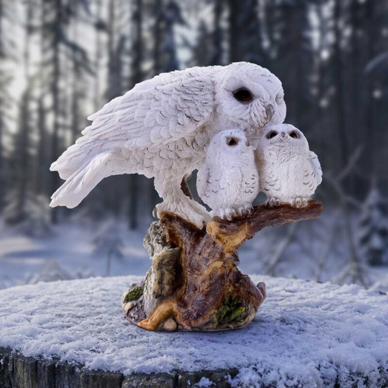 Snowy owl family sculpture