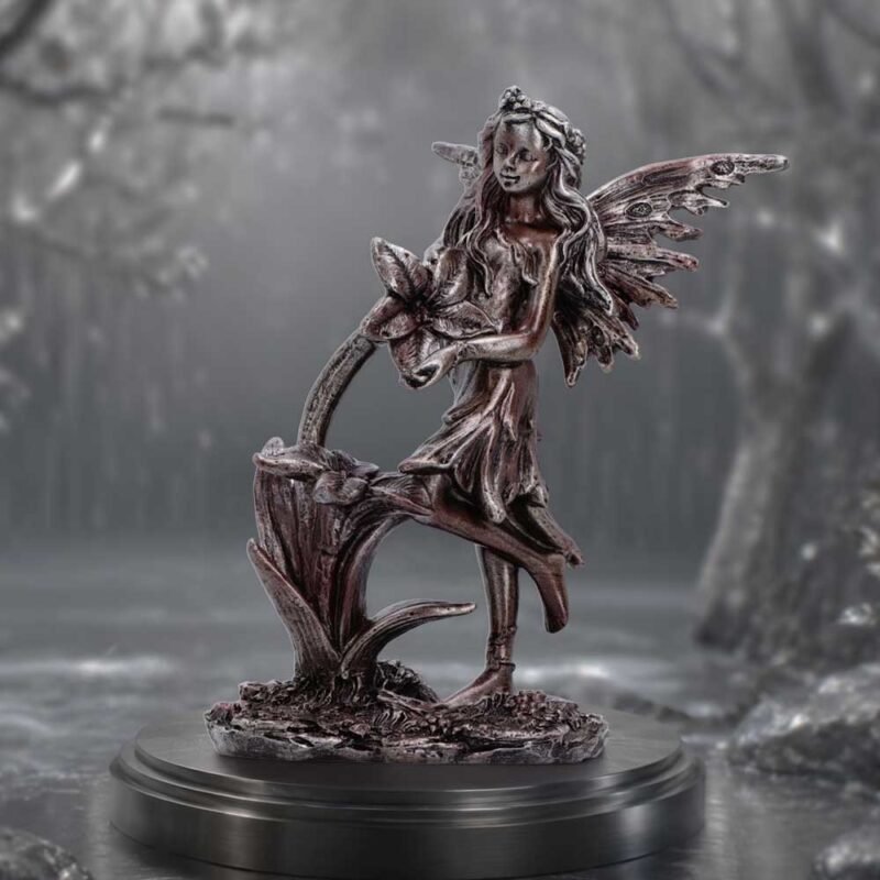 Fairy holding a flower figurine
