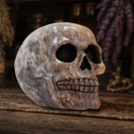 Marble skull on wooden table