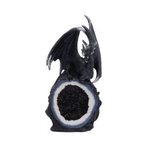 Black dragon figurine on geode