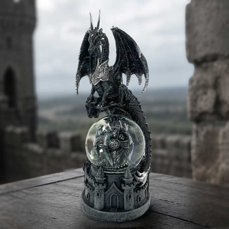 Dragon statue with snow globe